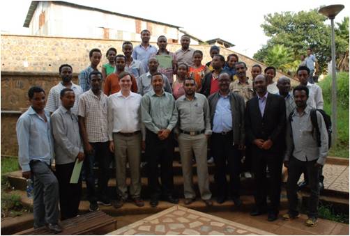 large group of smiling men and women