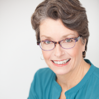 bheadshot of woman smiling at camera