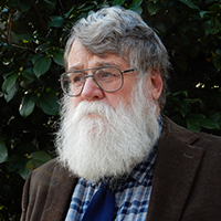 man with beard looking into distance