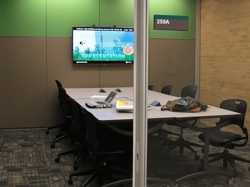 study room with tables, chairs, TV screen