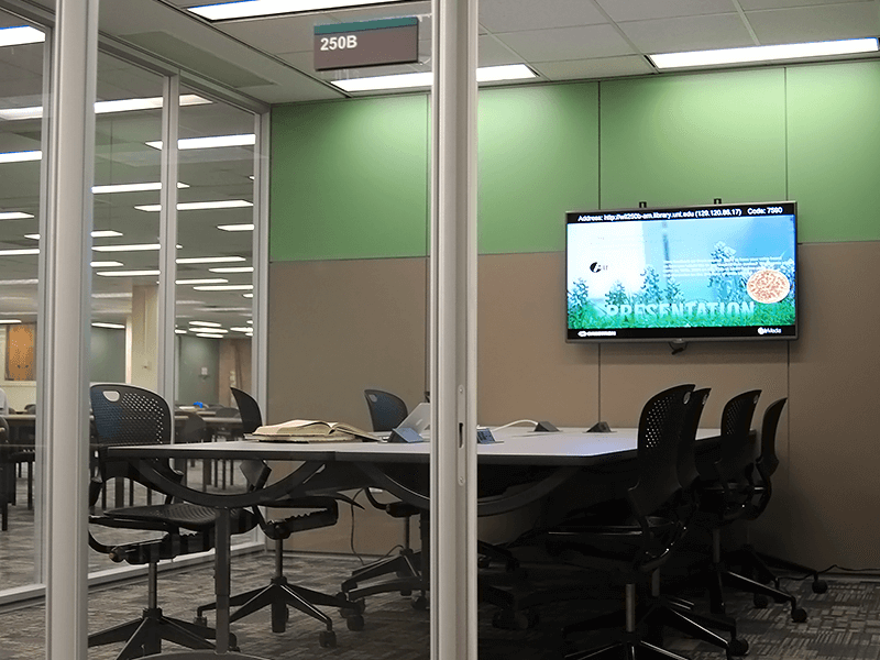 study room with tables, chairs, TV screen