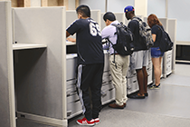 students at the printing release station